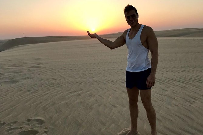 4 Hour Desert Safari, Camel Ride & Inland Sea Beach - Sandboarding for a quick burst of fun