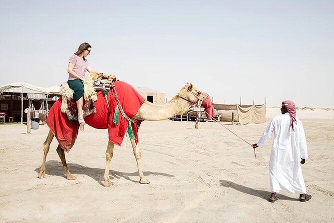 Desert Safari Combo: Camel Ride, Sandboarding & Inland Sea Visit - Sandboarding from the dunes
