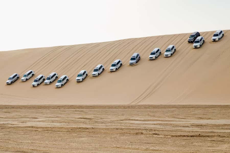 Desert Safari, Dunes Ride, Sand Boarding & Inland Sea Tour - Sandboarding from the viewpoint