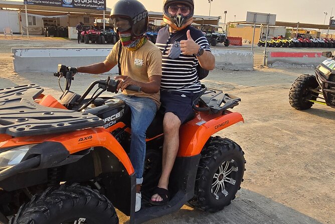 Desert Safari, Quad Bike, Sandboarding and Camel Ride - Sandboarding gives the dunes a playful pause
