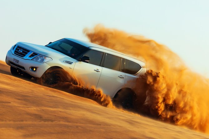 Desert Safari with Camel Ride, Sand Boarding & Inland Sea Tour in Doha - Dune bashing in a Land Cruiser