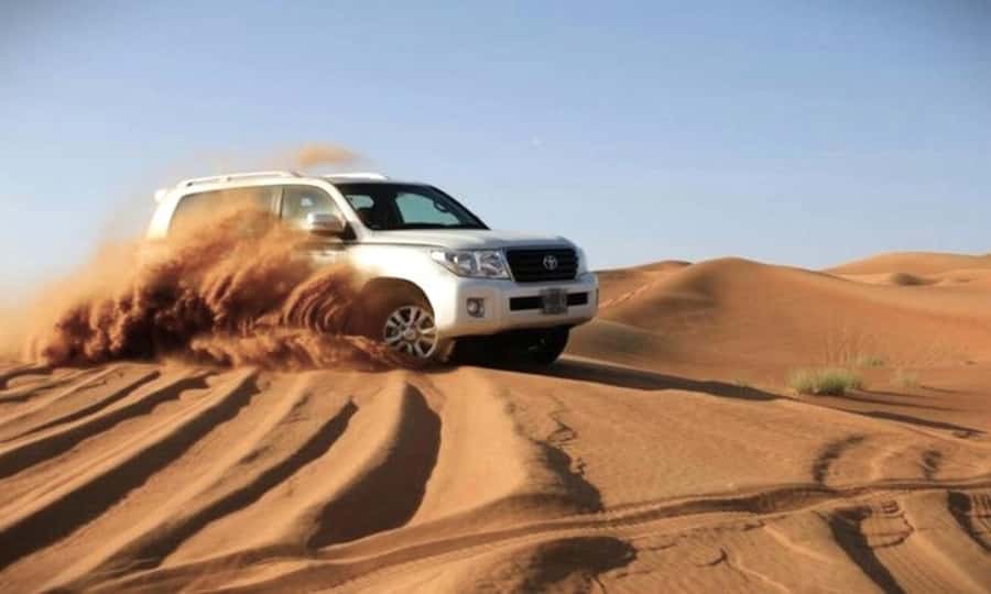 Doha: Desert Safari Dune Bashing, Sandboarding, & Camel Ride - Leaving Doha for Qatar’s southern desert