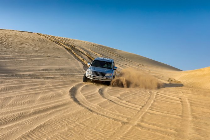Doha Desert Safari: Dunebashing, Camel, Sandboarding & Inland Sea - Clothing, comfort, and safety tips