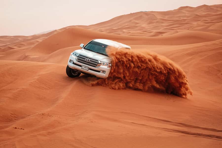 Doha: Desert Safari, Sandboarding, Dune Bashing & Inland Sea - Sandboarding on Qatar’s dunes