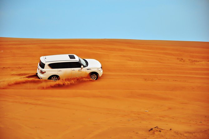 Doha: Desert Safari With Quad bike ,Camel Ride And Sand Boarding - Dune bashing across the red sand