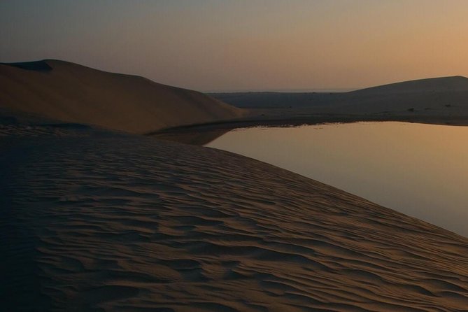 Doha: Desert Safari With Quad bike ,Camel Ride And Sand Boarding - Sandboarding on the dunes