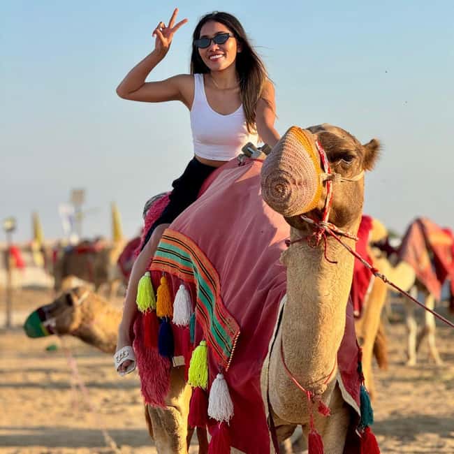 Doha: Family Desert Safari with Camel and Dune Ride - Beach time, sandboarding, and Saudi mountain views