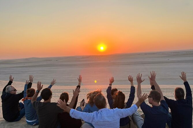 Doha Half Day Desert Safari Dune Bashing Camel Ride Sandboarding - Sunset on the ride back