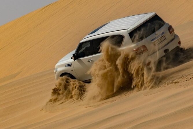 Doha Half Day Desert Safari Dune Bashing Camel Ride Sandboarding - Leaving Doha for Qatar’s southern desert