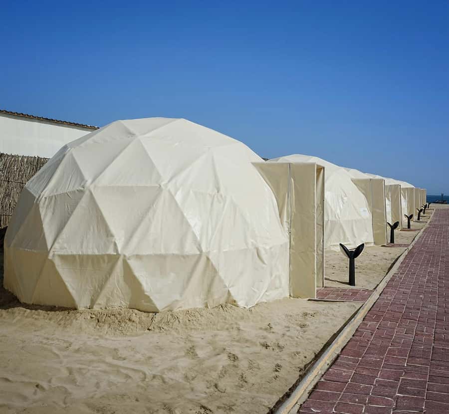 Doha: Overnight Desert Camping With BBQ Dinner & Breakfast - Sealine Beach and the first taste of sand
