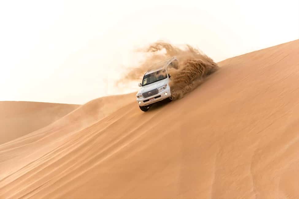 Doha Qatar : sealine adventure Camel Ride sandboard Sunset - Leaving Doha for Qatar’s southern desert