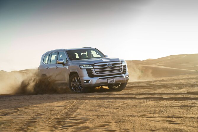 Doha Quad Bike, Dune Bashing, Camel Ride and Inland Sea Tour - Sandboarding on Sealine’s dunes