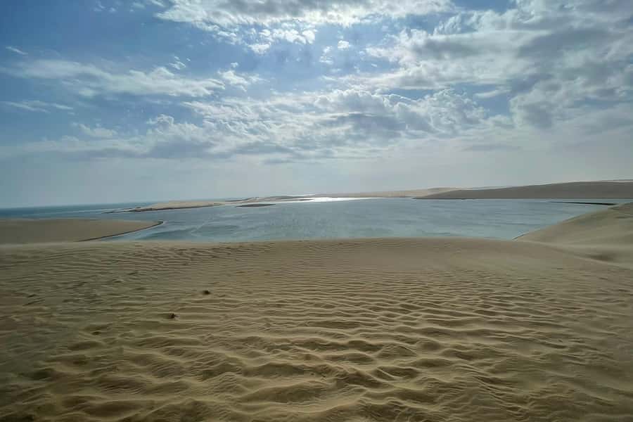 Doha Safari: ATV Ride, Dune Bashing, & Sandboarding Fun - Dune Bashing Toward Khor Al Udeid
