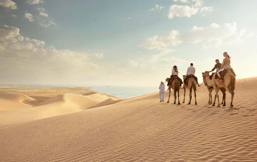 Doha: Safari, Camel Ride, Sandboarding and Inland Sea Tour - Camel riding, a brief taste of older desert travel