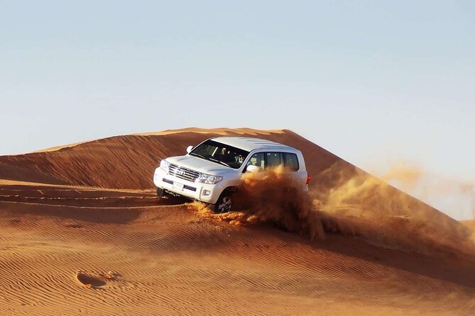 Doha Sharing Desert Safari with Dune Bashing and Sand Boarding - Sandboarding on the dunes
