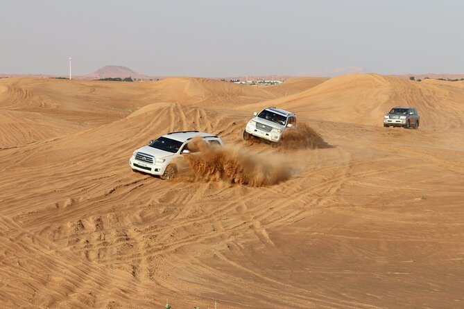 Doha Sharing Desert Safari with Dune Bashing and Sand Boarding - Dune bashing across the golden sand
