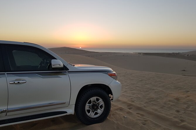 Doha: Sunrise /Sunset Desert Safari with Sand Boarding,Camel ride - Khor Al Udaid and the Inland Sea