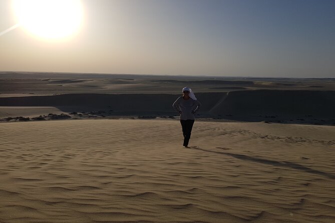 Doha: Sunrise /Sunset Desert Safari with Sand Boarding,Camel ride - The guide and driver experience