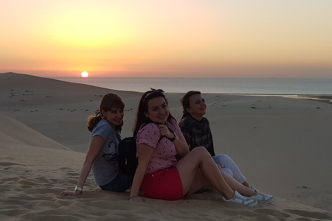 Doha: Sunrise /Sunset Desert Safari with Sand Boarding,Camel ride - Dune bashing across Qatar’s southern dunes