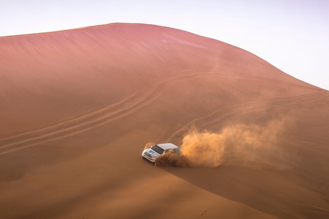 Doha: Sunset Desert Safari, Camels, Sandboarding & Inland Sea - Leaving Doha in an air-conditioned 4x4