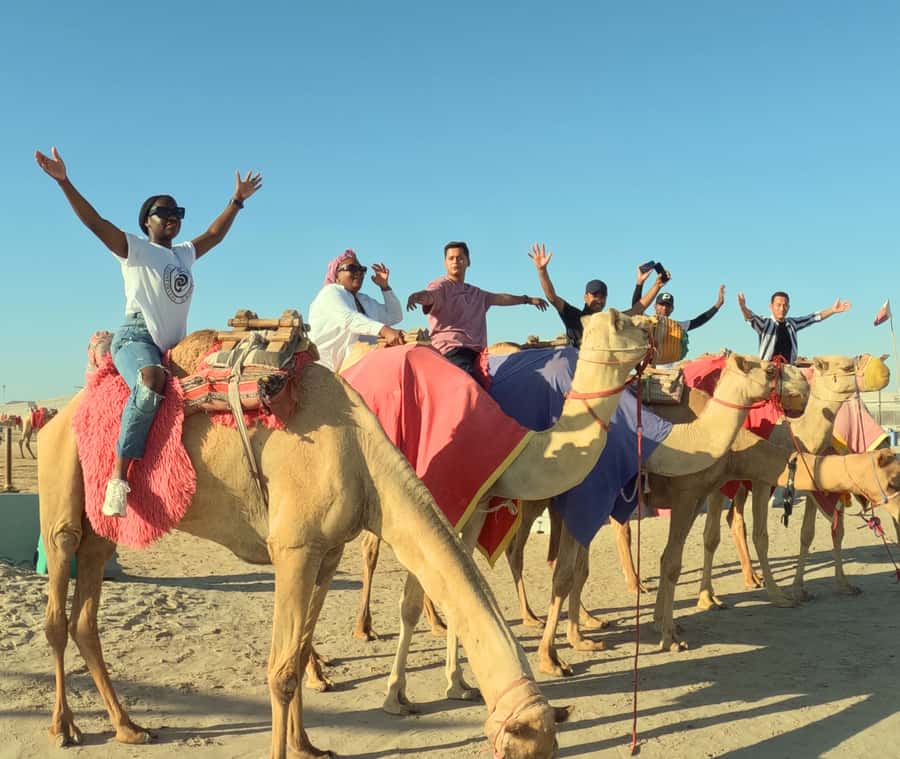 Doha: Sunset Desert Safari with Camel Ride and Sandboarding - The camel stop offers a slower view of Qatar