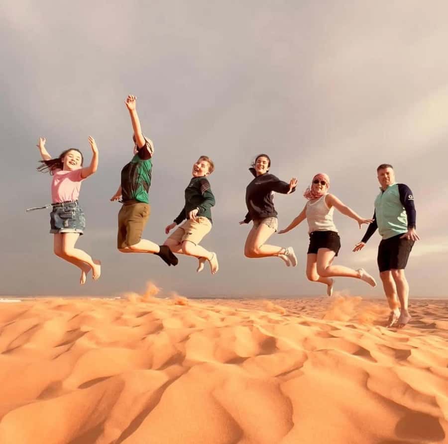 Doha: Sunset Desert Safari with Camel Ride & Sandboarding - From Doha streets to open desert