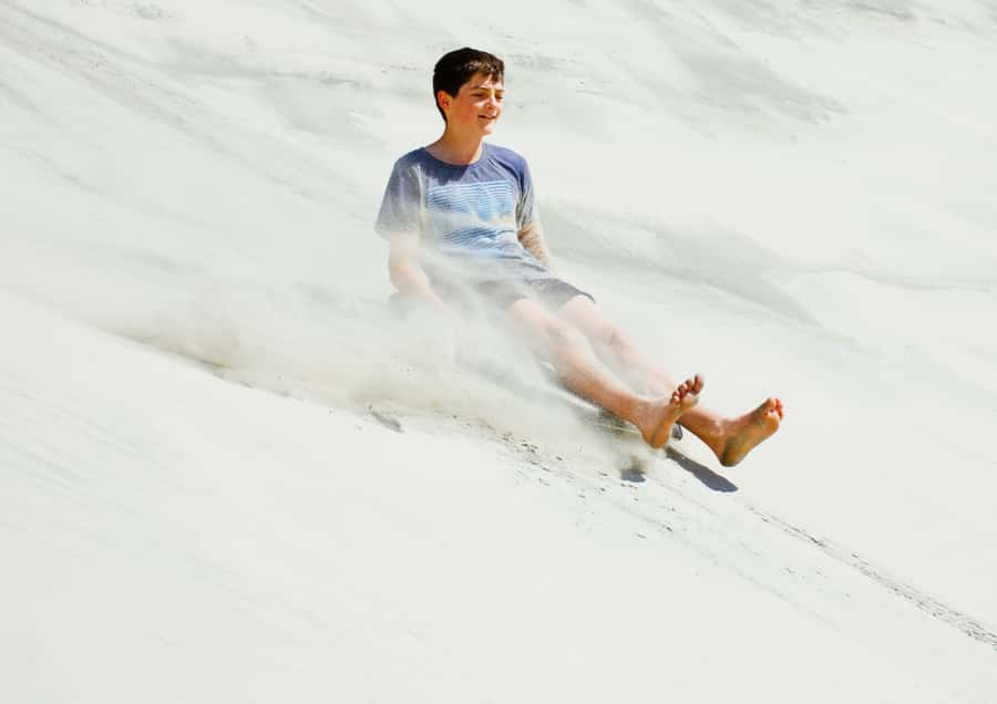 Dune Bashing, Sandboarding, Camel Ride & Optional ATV Ride - Dune bashing across Qatar’s golden dunes