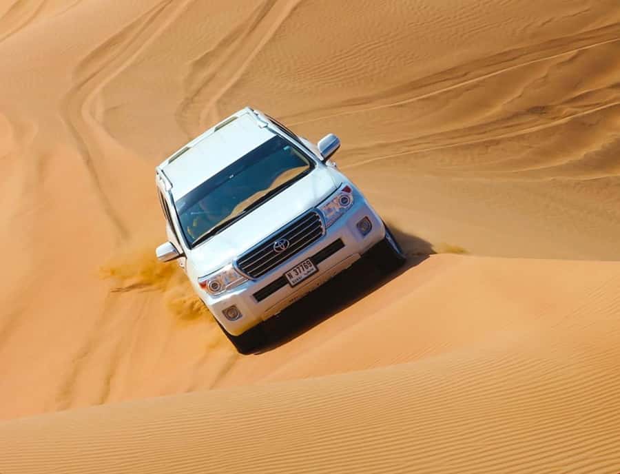 From Doha: Inland Sea Desert Safari with All Activities - Dune bashing in a Land Cruiser