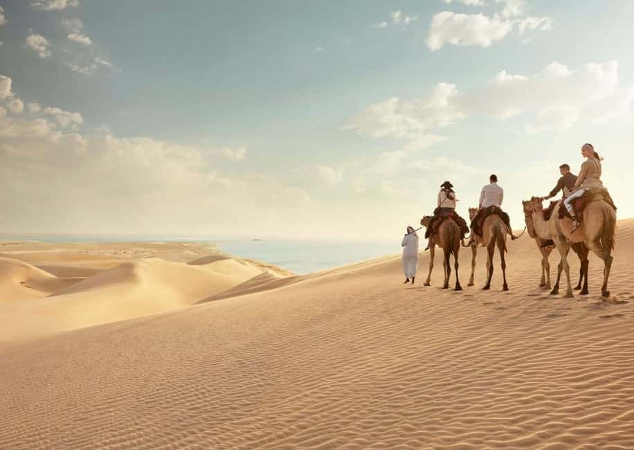 Qatar: ATV & Quad Dune Bashing, Camel Ride, & Sandboarding - Dune bashing in a professional 4x4