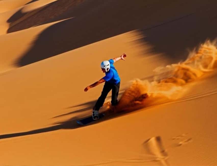 Qatar: ATV & Quad Dune Bashing, Camel Ride, & Sandboarding - Sandboarding down the dunes